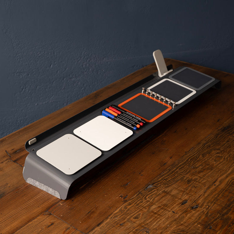 Dry Erase Desk organizer with multiple compartments on a wooden surface