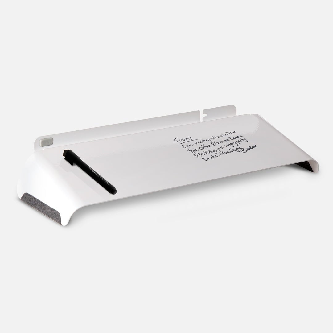 White Slope desk whiteboard with a daily agenda and a magnetic marker on its surface